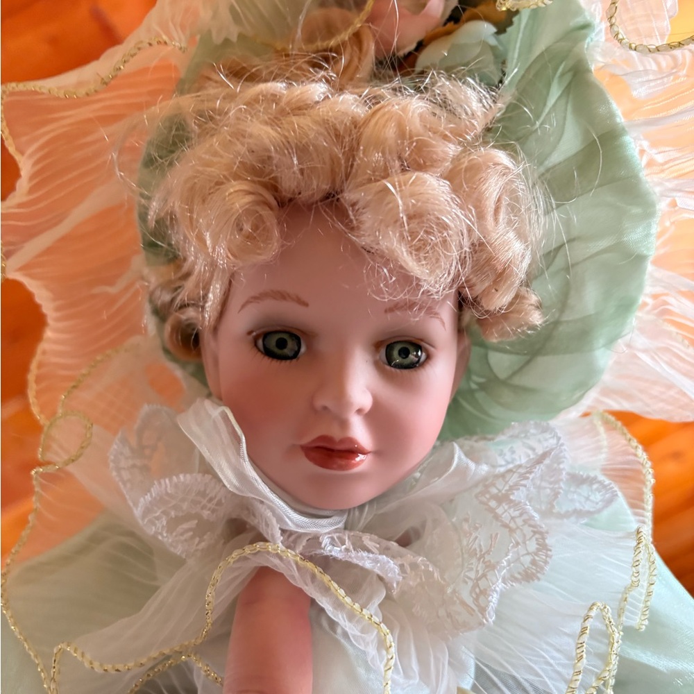 Doll with Blonde Curls and Green Dress